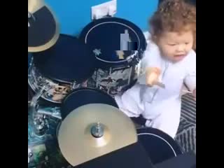 baby playing drums