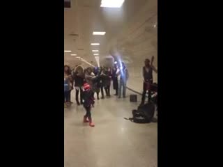 girl conducts street musicians