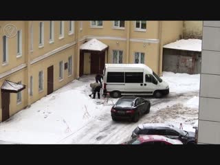 in st. petersburg, filmed as two unknown people in a tinted minibus