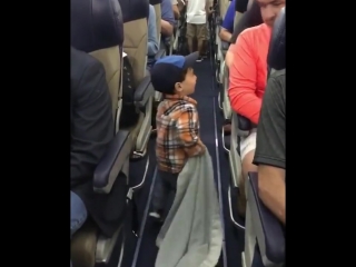 the boy says goodbye to the passengers on the plane