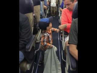 the boy says goodbye to everyone on the plane