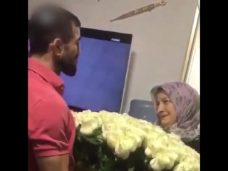 son gave mom a huge bouquet of flowers