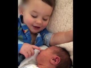 brother plays with little sister