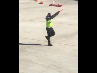 the traffic controller danced to cheer up the passengers