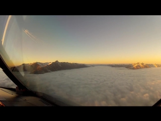 plane landing through thick clouds in new zealand