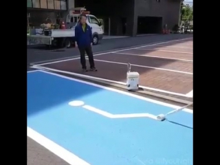 road marking master draws a handicapped place sign