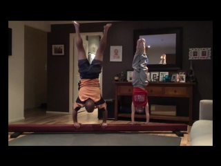 father copies daughter's gymnastic exercises