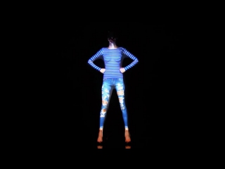 cool light show on the girl's body, using projection